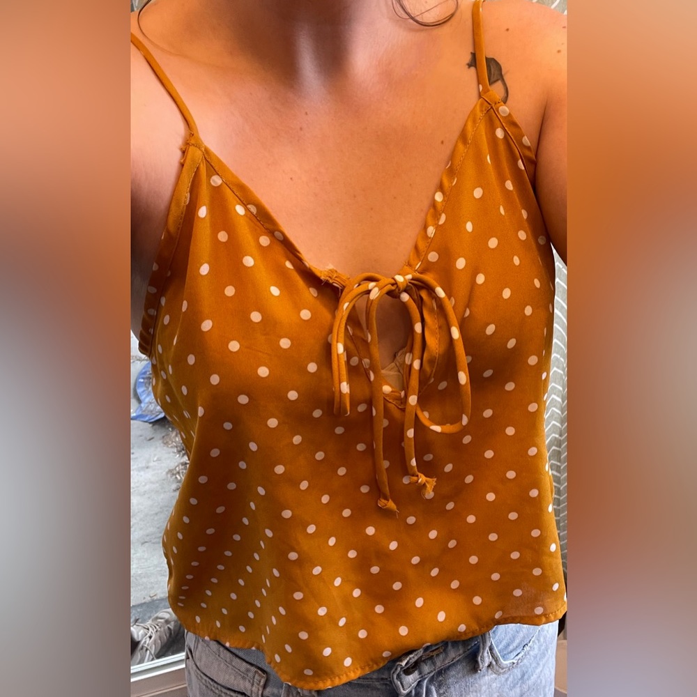 Cute, light, yellow and white polka dot, cropped tank top with tied keyhole